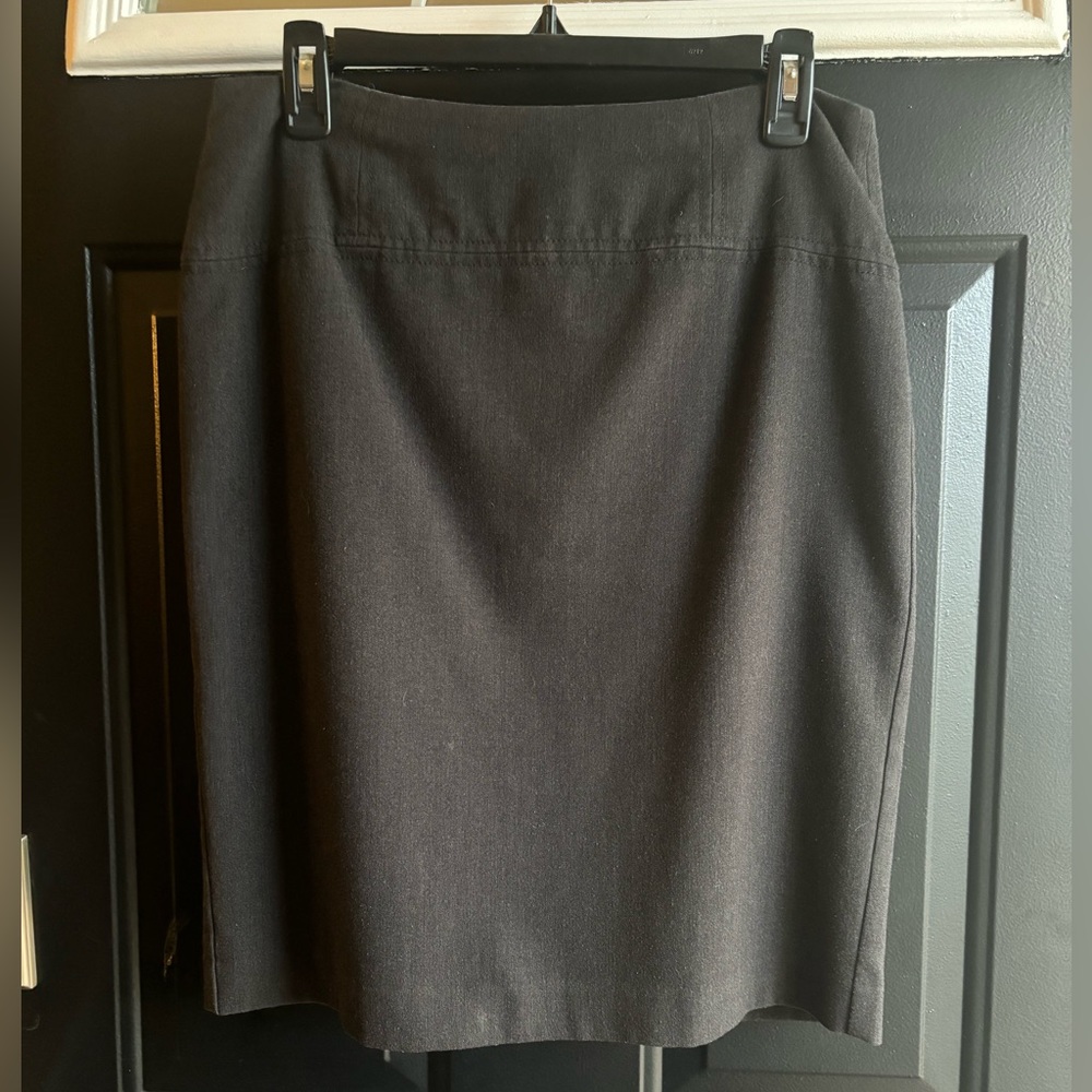 Dark grey knee length business skirt.